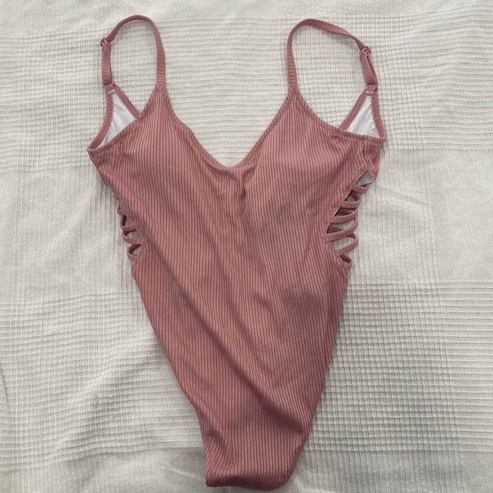 Size large Pink Victoria’s Secret bathing suit. One piece